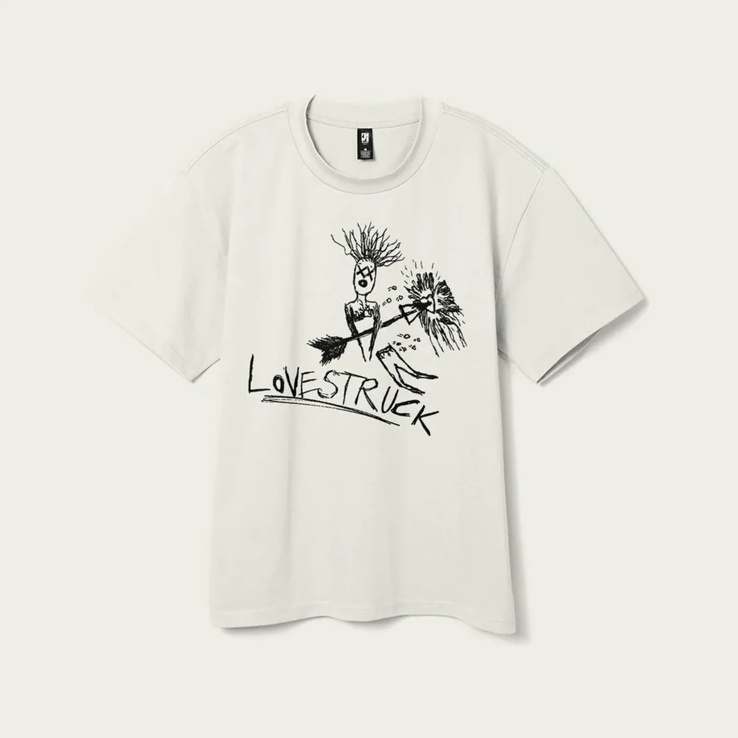 A white oversized T-shirt: a wild-haired figure with an arrow straight through it, above the word Lovestruck