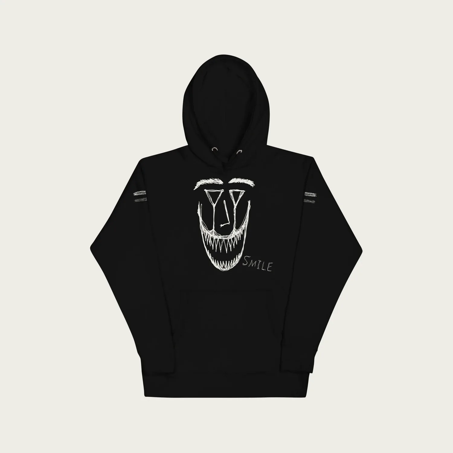 A black hoodie with a huge drawn grin in white: slanted eyes and two rows of sharp teeth, and the word Smile